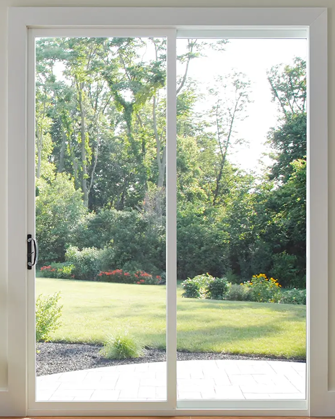 Impact sliding glass doors opening to a Florida patio